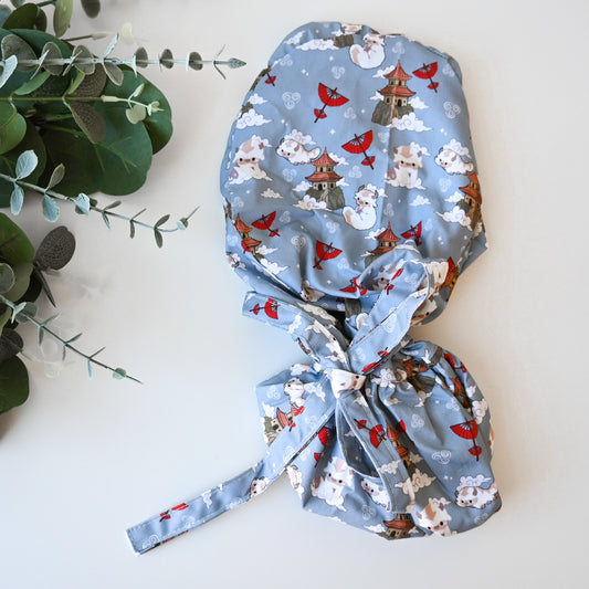 ATLA - APPA FLYING WITH SKY TEMPLES SATIN LINED PONYTAIL SCRUB CAP