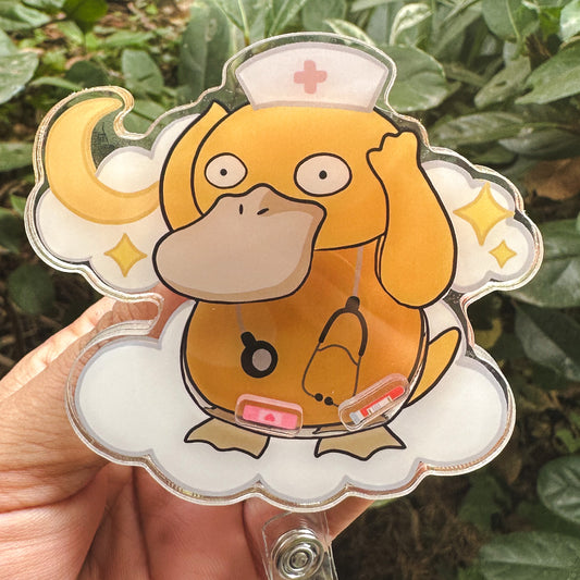 POKEMON - PSYDUCK MEDICAL THEMED ACRYLIC SHAKER BADGE REEL